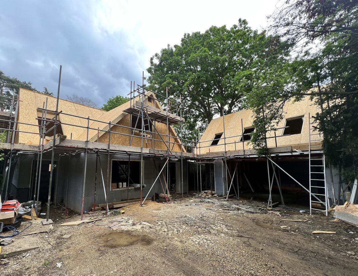 Install crew erecting panels on a housing scheme